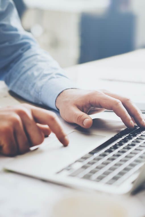 Man typing on laptop