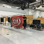 Kia logo being carried by man